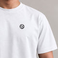 Traveler Globe Tee in White with globe chest embroidery