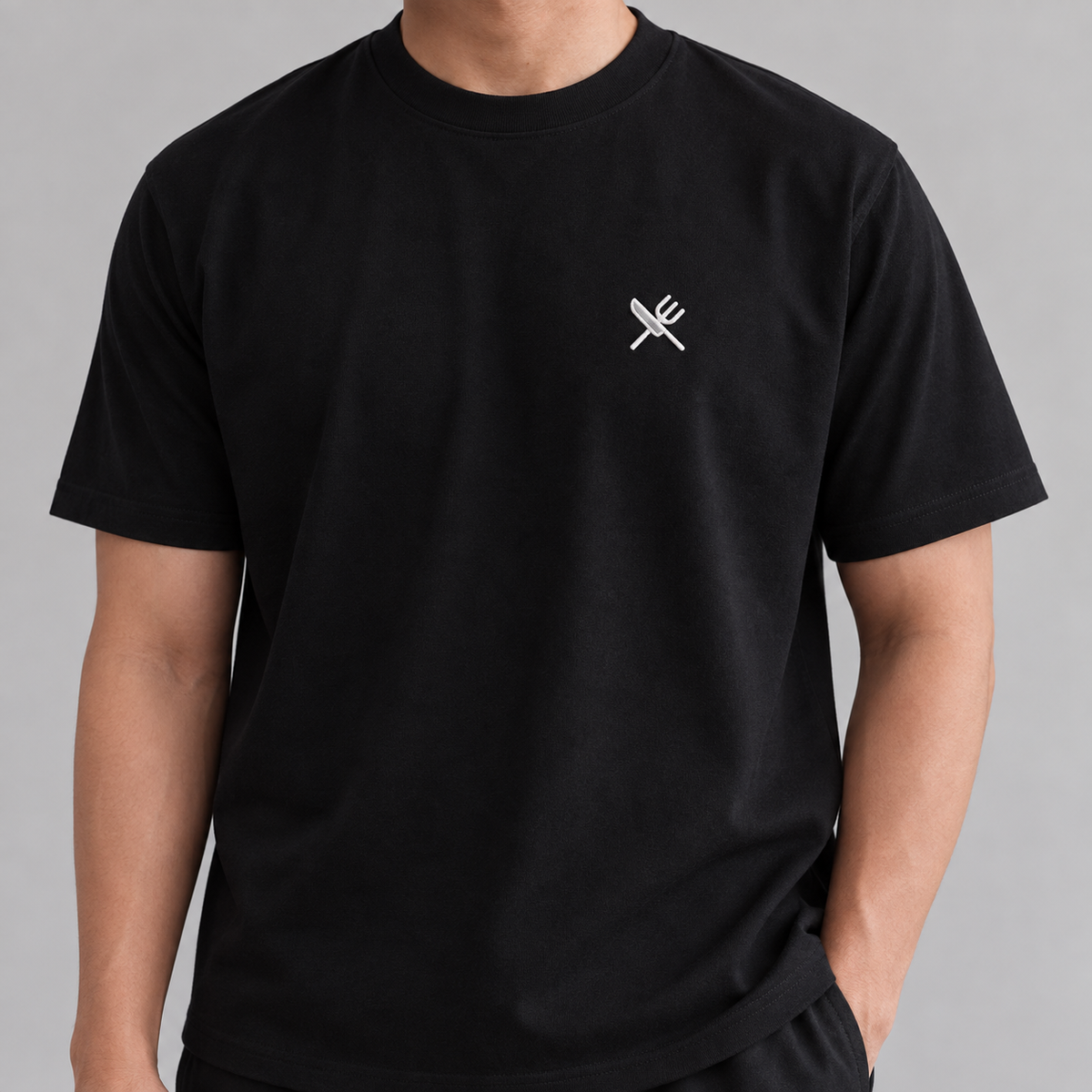 Chef Knife Tee in black with white embroidered crossed knife and fork