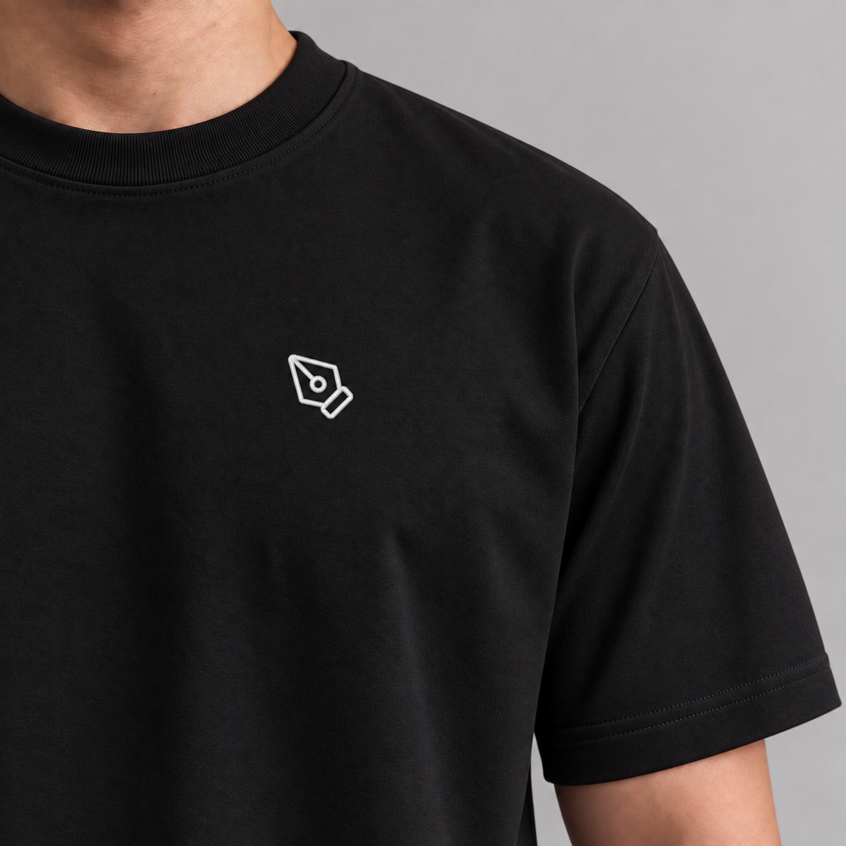 Designer Pen Tool Tee in Black with embroidered pen tool icon