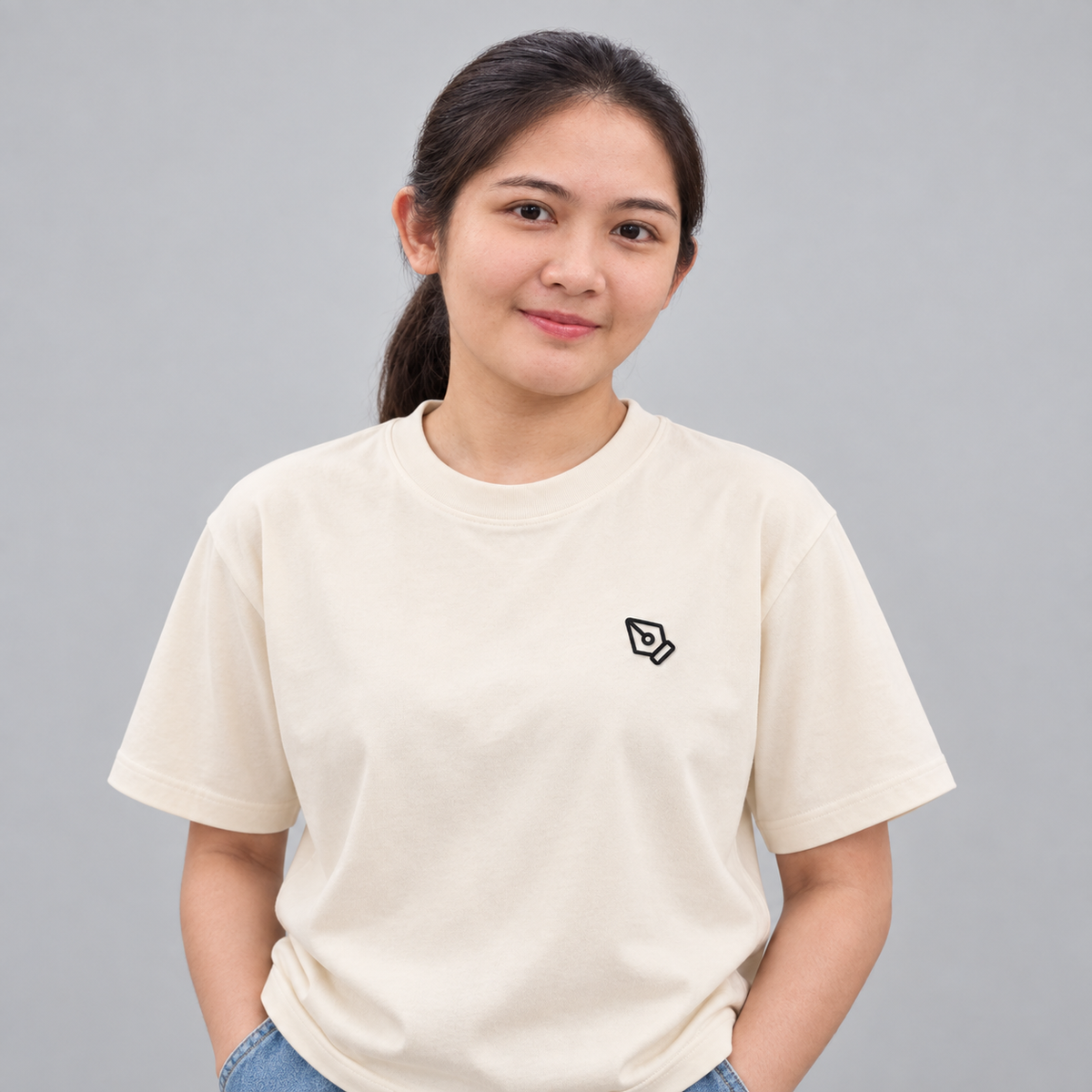 Designer Pen Tool Tee in Cream with embroidered pen tool icon