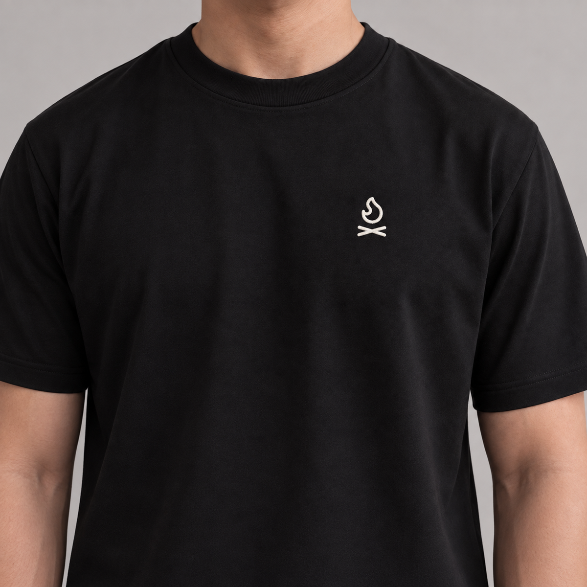 Camper Campfire Tee in black with white campfire embroidery